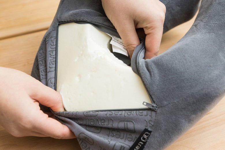 Opening the cover of the Travelrest to reveal foam inside.